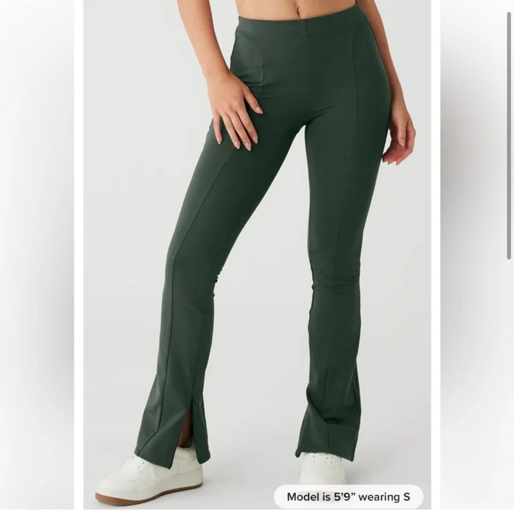 Alo‎ Yoga High-Waist Zip it Flare Legging in Dark Cactus Green.